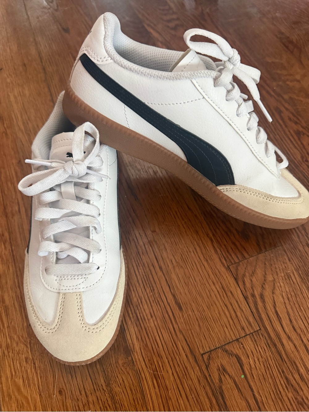 Puma women’s White Sneakers with Black Formstrip and Gum Sole